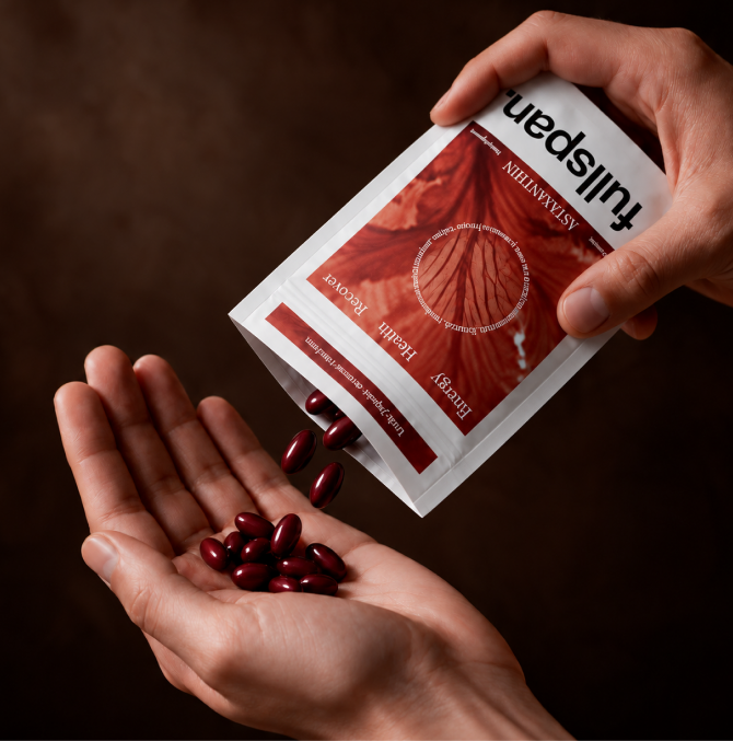 fullspan astaxanthin softgels poured from the pouch into a hand